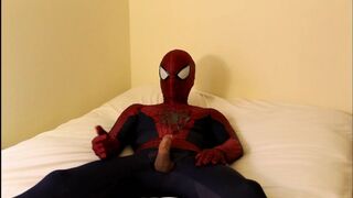 spiderman jerks off and finishes off all over his suit