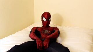 spiderman jerks off and finishes off all over his suit